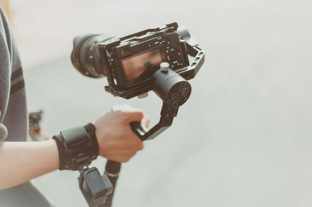 A man holding a camera.