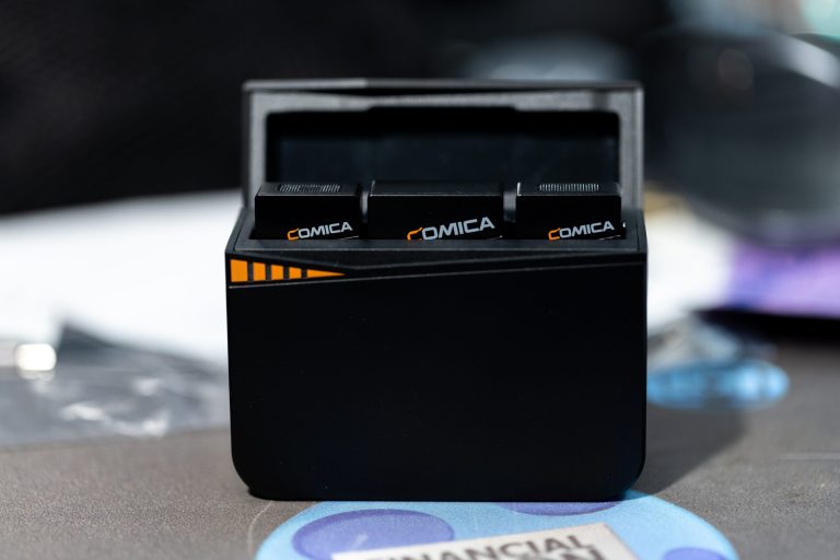 Comica Vimo 3 microphone inside of charging case.