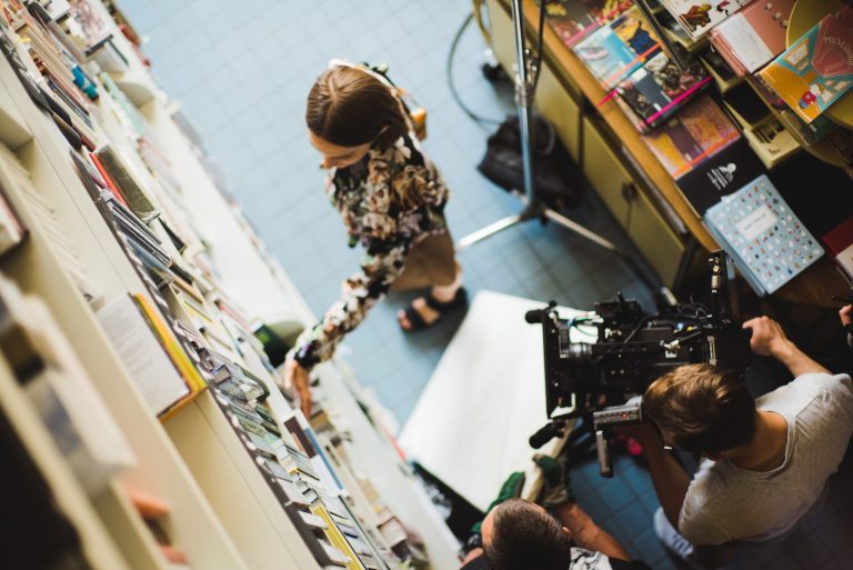 Person in book store recording a video