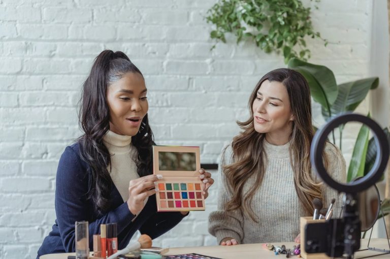 Women business owners doing a video about makeup